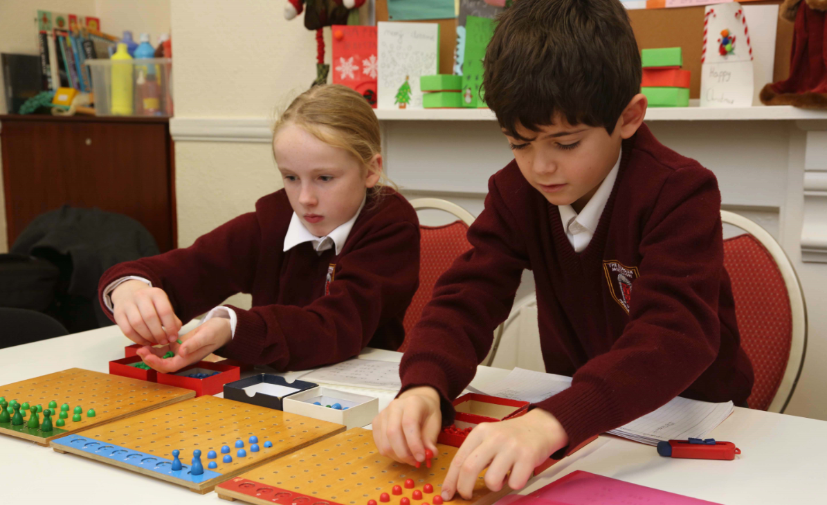 Children in 9-12 classrom working with Montessori Math materials in The Georgian Montessori Primary School